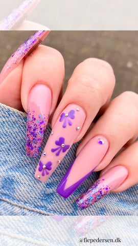 purple acrylic nails with v-tips and bows