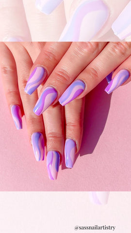purple acrylic nails with swirls