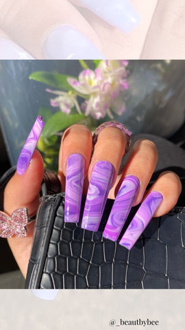 purple acrylic nails with marble