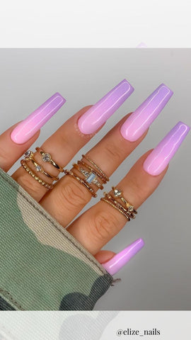 purple acrylic nails with an ombre design