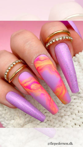 purple acrylic nails with orange and pink design