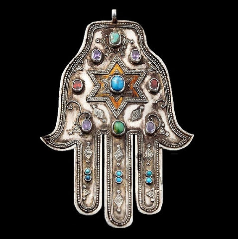 Hamsa hand pendant with precious stones