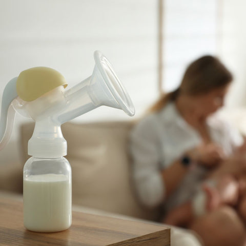 Breast pump bottle with milk in it