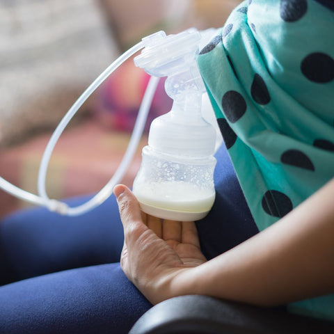 woman using a breast pump