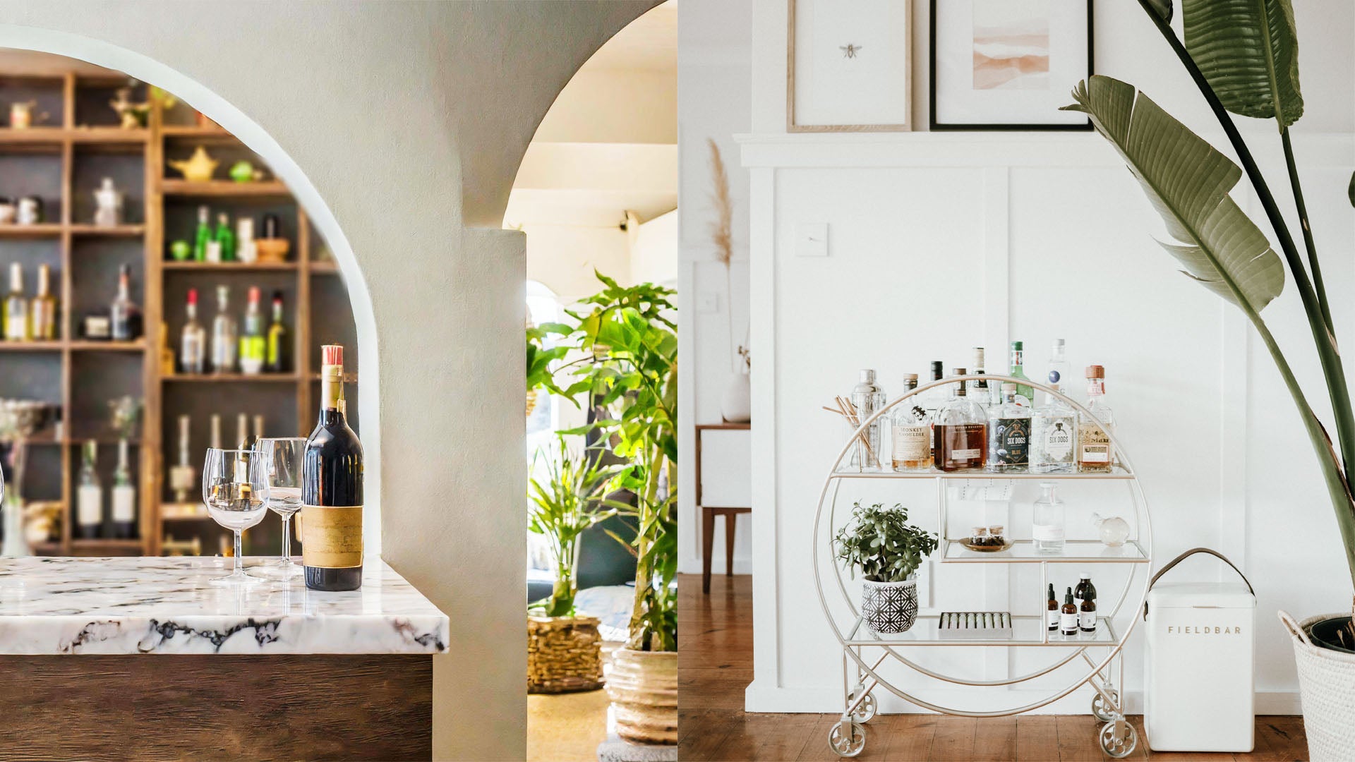 Home bar with wine bottle and glasses on marble counter with shelves in the background, contemporary bar cart with white board and batten wall.