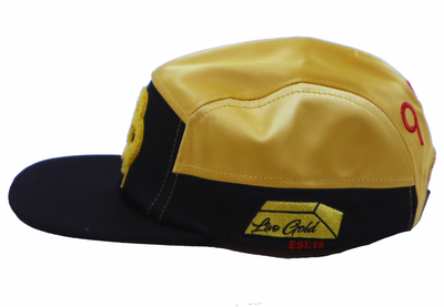 The other side of the Gold Boys 1 Year Anniversary hat. This side panel has a custom-embroidered image of a gold bar, with the saying 'Live Gold' within it, and a callout of 'EST. 19' underneath.