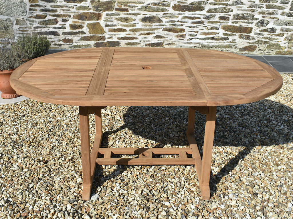 side view of extending 120x180cm teak circular/oval dining table