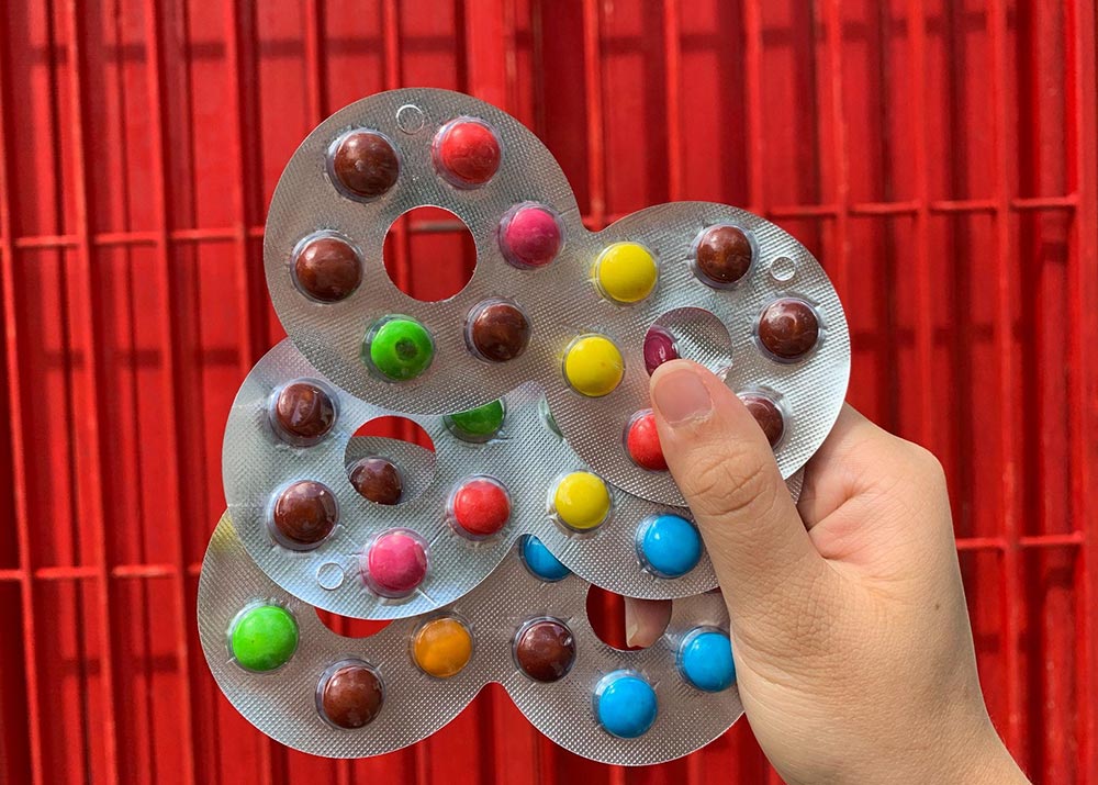 Three pieces of bangle chocolate held by a person