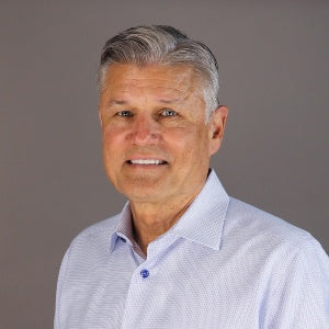 Merchology Chairman and Founder, Dick Ward, in a professional headshot photo