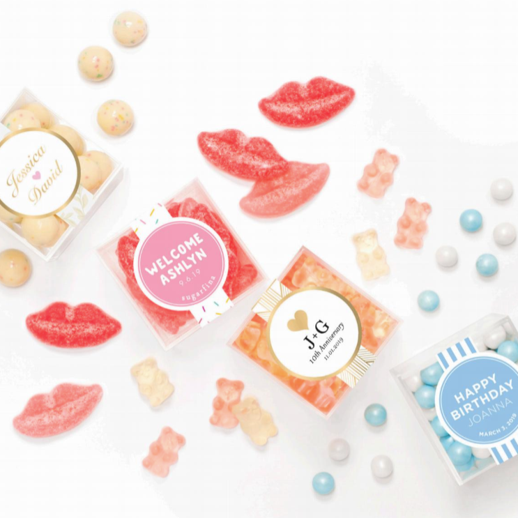 Delicious custom logo printed Sugarfina candy set out on a table