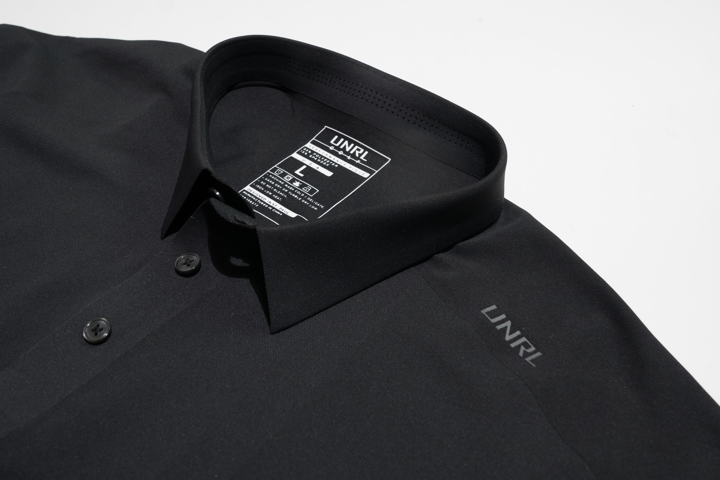 Add your company logo to custom UNRL Polo with Merchology!