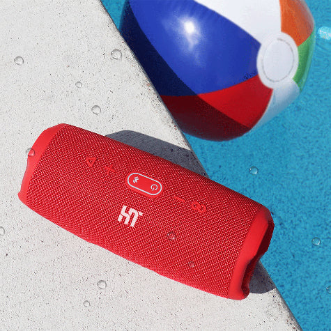 A red custom JBL bluetooth speaker near a pool
