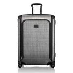 A silver and black custom TUMI suitcase with roller wheels and a handle against a white background