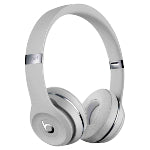 A pair of white and silver custom logo Beats by Dre headphones in front of a white background