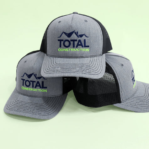 Get your company logo embroidered on corporate Richardson hats, trucker hats, and mesh caps with Merchology