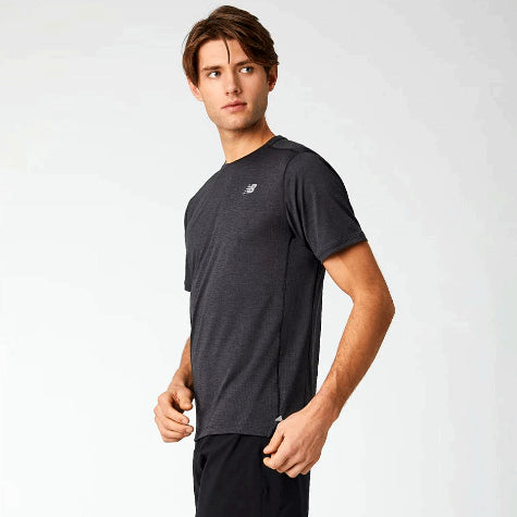 A man standing to the side with a dark gray custom New Balance t-shirt for men