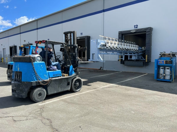 Embroidery machines being installed in Merchology's Reno, NV facility