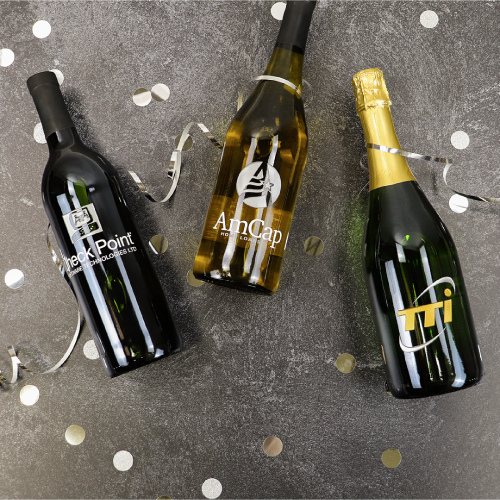 Custom logo-branded wine bottles and corporate gifts with confetti help corporate events go well