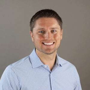 Merchology Chief Revenue Officer, Andrew Ward, sitting in a professional headshot