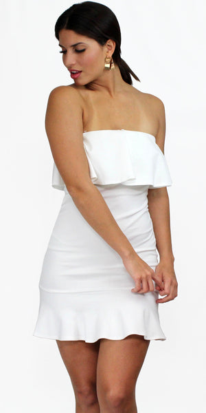 white dress with ruffles at the bottom