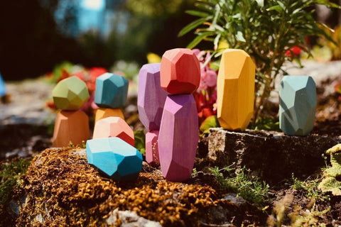 Ocamora Rainbow Teniques - lifestyle photo of brightly colored wooden stacking stones by Spanish toymaker Ocamora