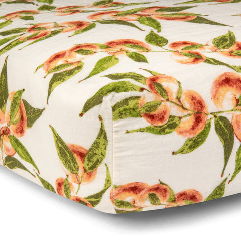 Milk Barn kids new crib sheets! 100% organic cotton crib sheet in Spring 2021 print Peaches. Product photo for Barn Chic Boutique. 