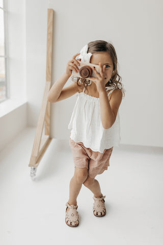 Jamie Kay Flourish Collection - girl in cloud bow, cloud Blake top, and Prague Quinn shorts