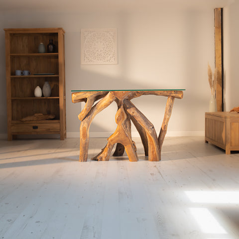 A teak root and tempered glass coffee table from the Rustic House collection