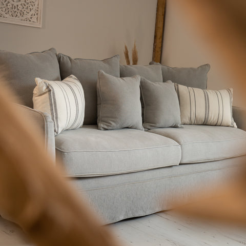 A grey three seater sofa - The Charlestown from the Rustic House range