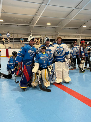 Hockey trainer with Pro Hockey Goalie Kevin Van Gate and youth hockey goalie of the game at the wish cup hockey tournament in Tennessee. 