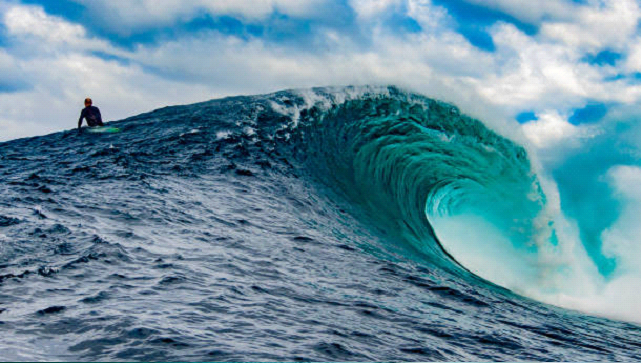 big blue surfing wave