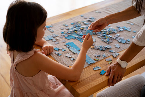 girls playing puzzle