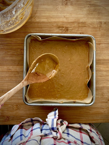 Dark spiced ginger cake batter in pan