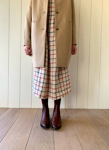 Pyne & Smith full length linen dress with wool coat, tights and boots