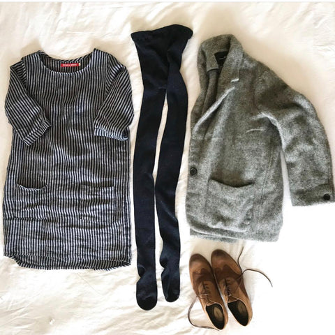 Flat lay images of jacket, dress, tights and boots