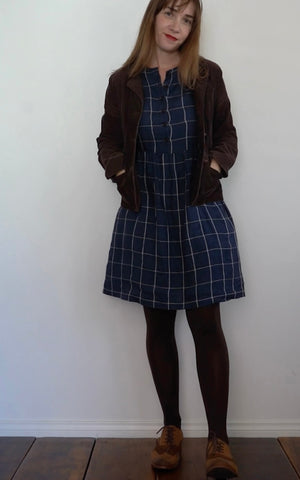 Jo wearing Model No.36 linen dress with jacket, tights and boots