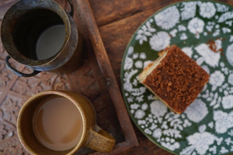 Crumb cake and tea on a wooden table