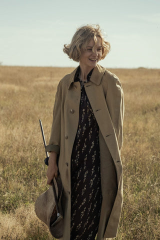 The Dig star Cary Mulligan in a vintage dress and trench coat