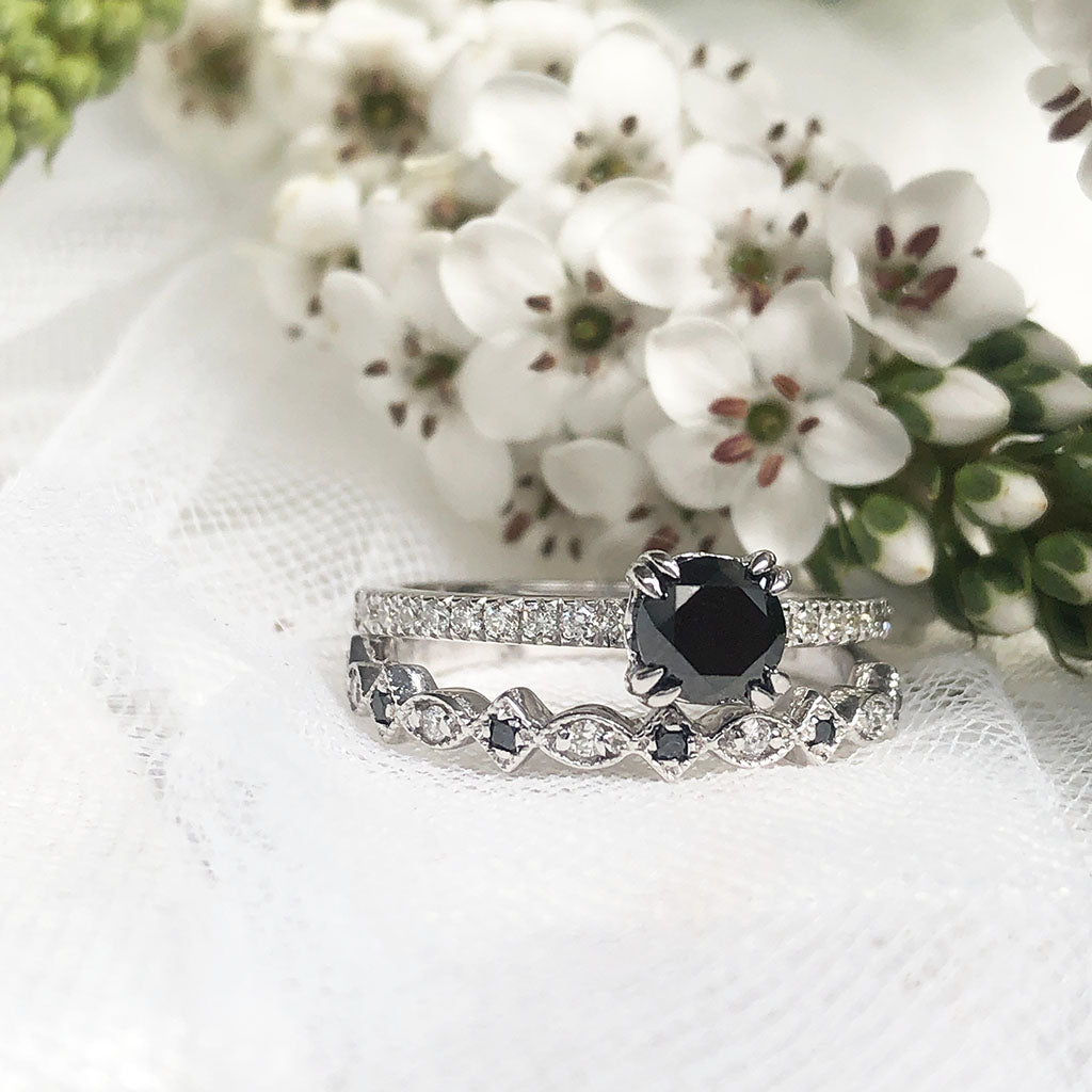 engagement ring with black diamond band