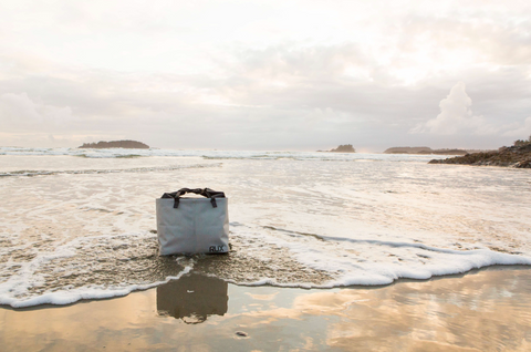 RUX Bag on the shoreline at sunset, standing proud and resilient.