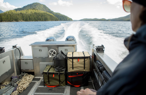 RUX gear at the back of the boat while on the water, showing all the gear stored and organized.