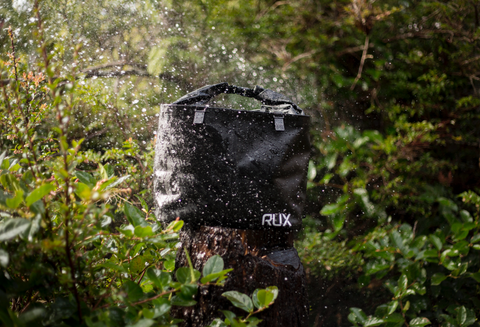 RUX Tote getting soaked from the rain but staying completely dry.