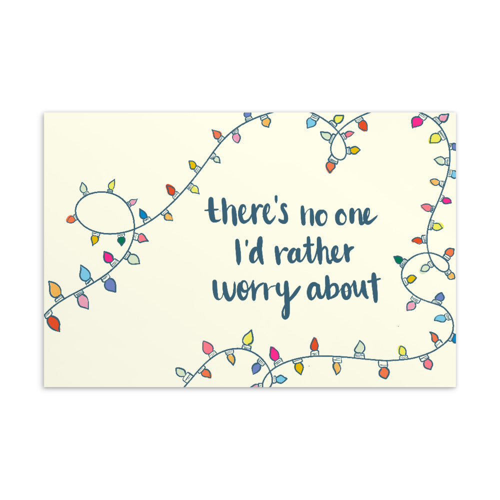 Beige postcard with illustration (by Christina Wolfgram) of holiday lights in various colors and, in calligraphy, “there’s no one I’d rather worry about.”