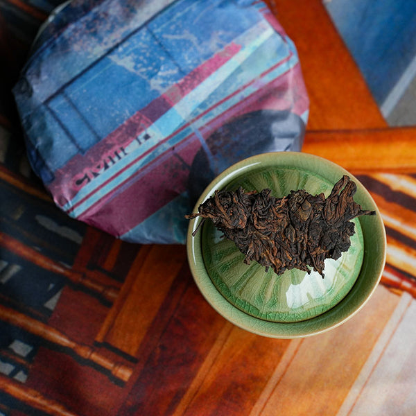 Small batch shou Puerh tea in a Celadon gaiwan