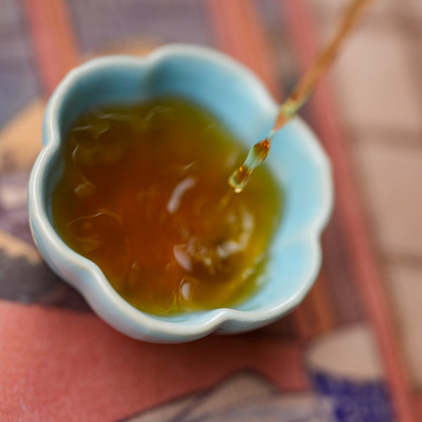 pouring tea into a gong fu teacup
