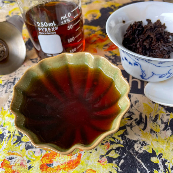 Shou Puer tea brewed in and in a teacup