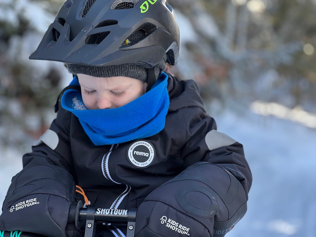 mountain bike kid dressed for the snow