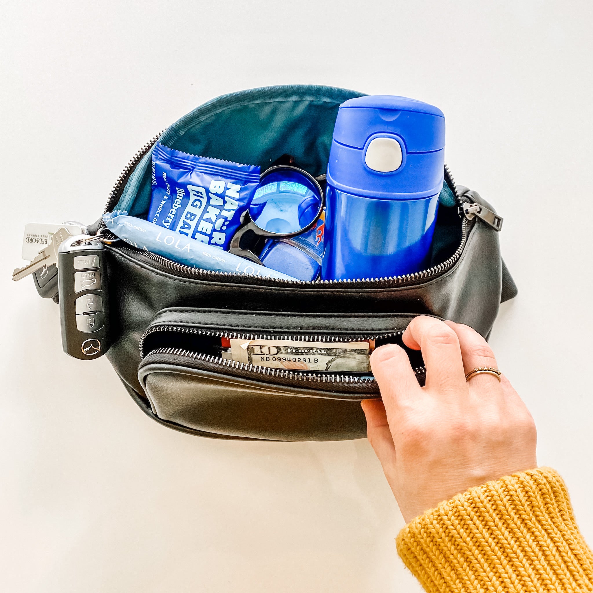 Kibou bum bag fanny pack with snacks, keys, water bottle, and essentials