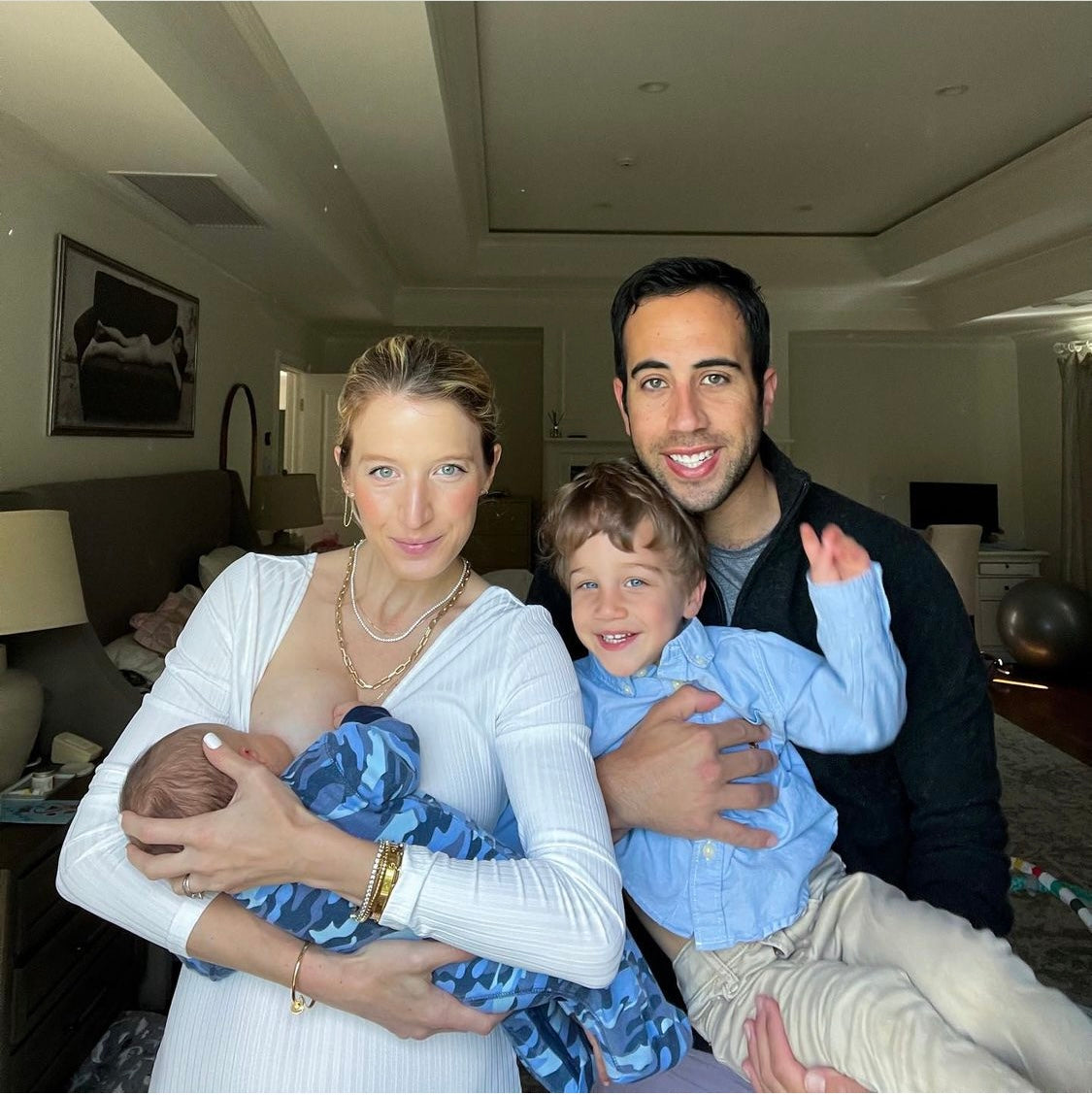 Stylish breastfeeding mom and family 