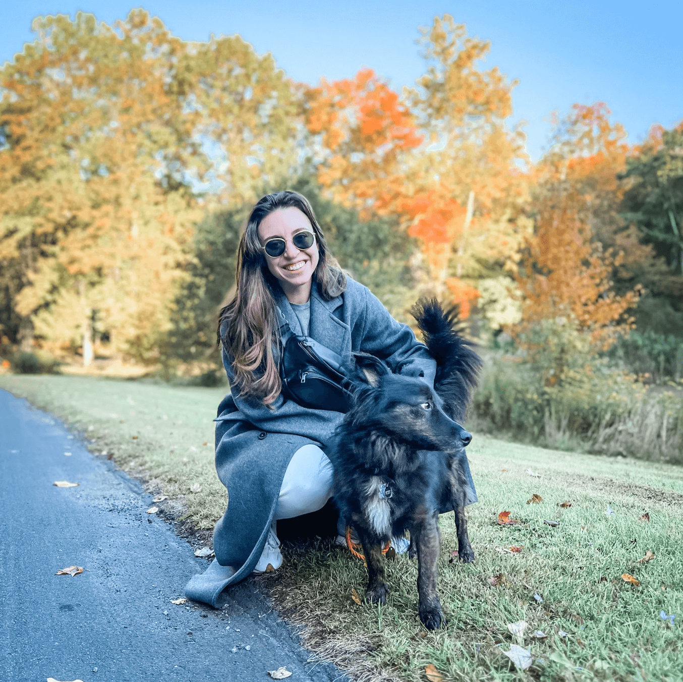 Woman with dog wearing her Kibou dog trainer fanny pack